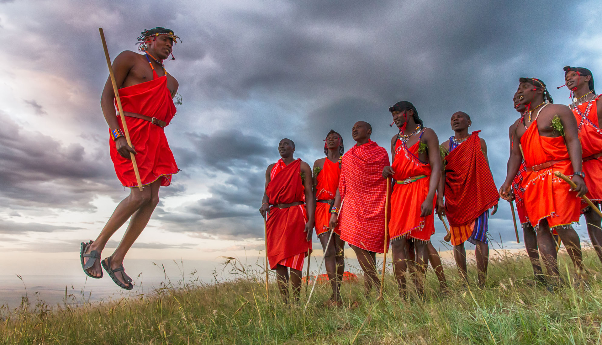 https://www.trackssafaris.co.uk/wp-content/uploads/2022/06/Massai-warriors-jumping-copy.jpg
