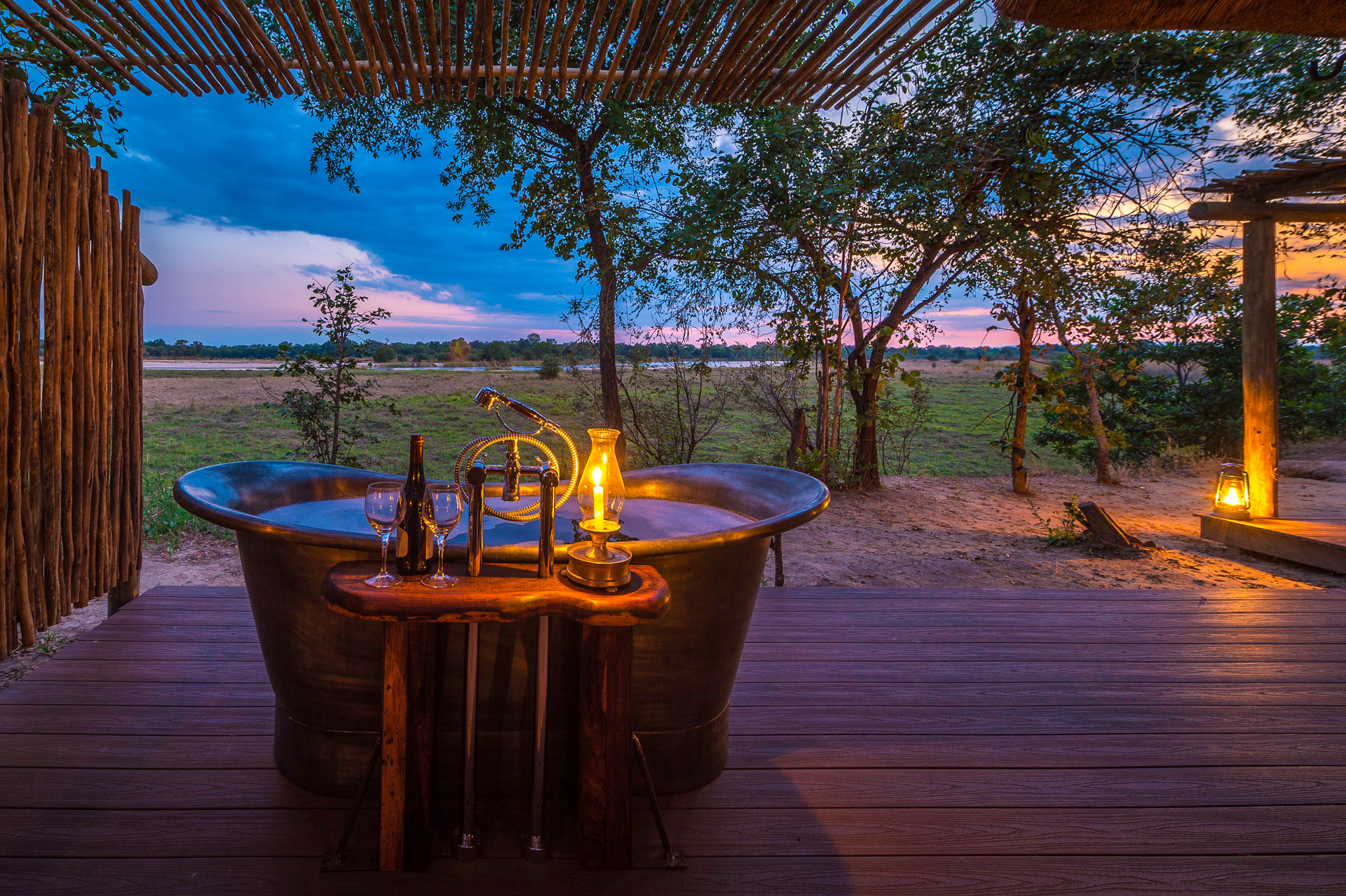 /wp-content/uploads/2022/07/10_THE-BUSHCAMP-COMPANY-Zungulila-sundowners-and-bubble-bath.jpg