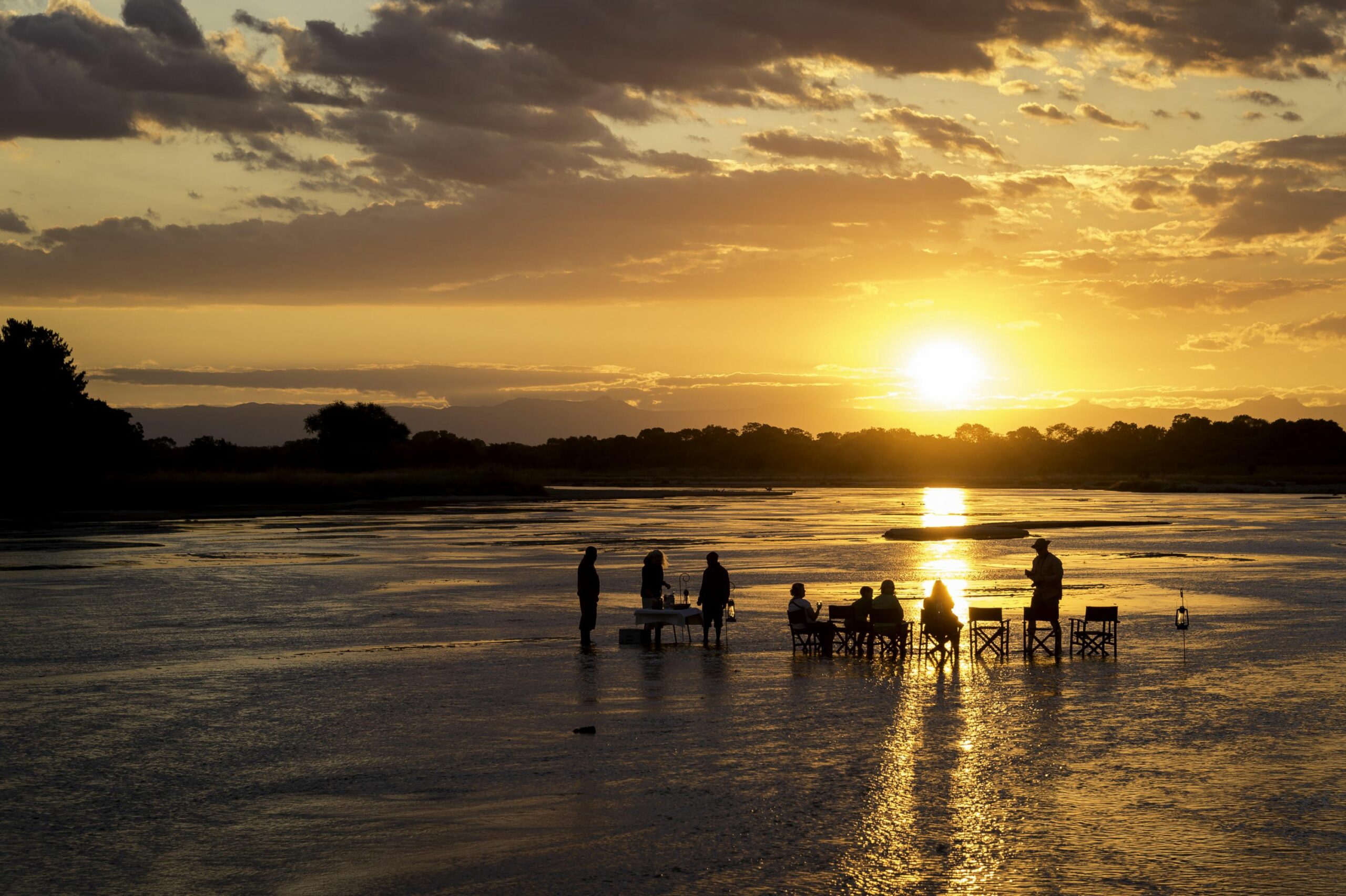 https://www.trackssafaris.co.uk/wp-content/uploads/2022/07/Bilimungwe-sundowners-scaled.jpg