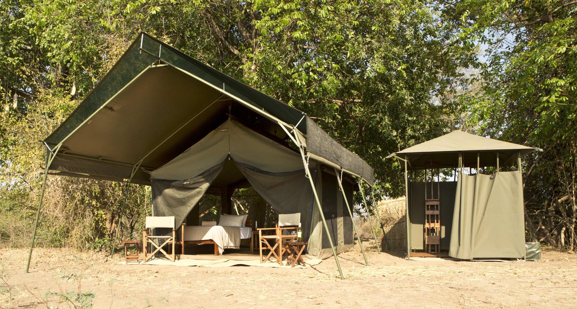 https://www.trackssafaris.co.uk/wp-content/uploads/2022/07/CAMP-Tent-TWIN-Set-Up-with-Bathroom-LR-SL1_0884-copy.jpg