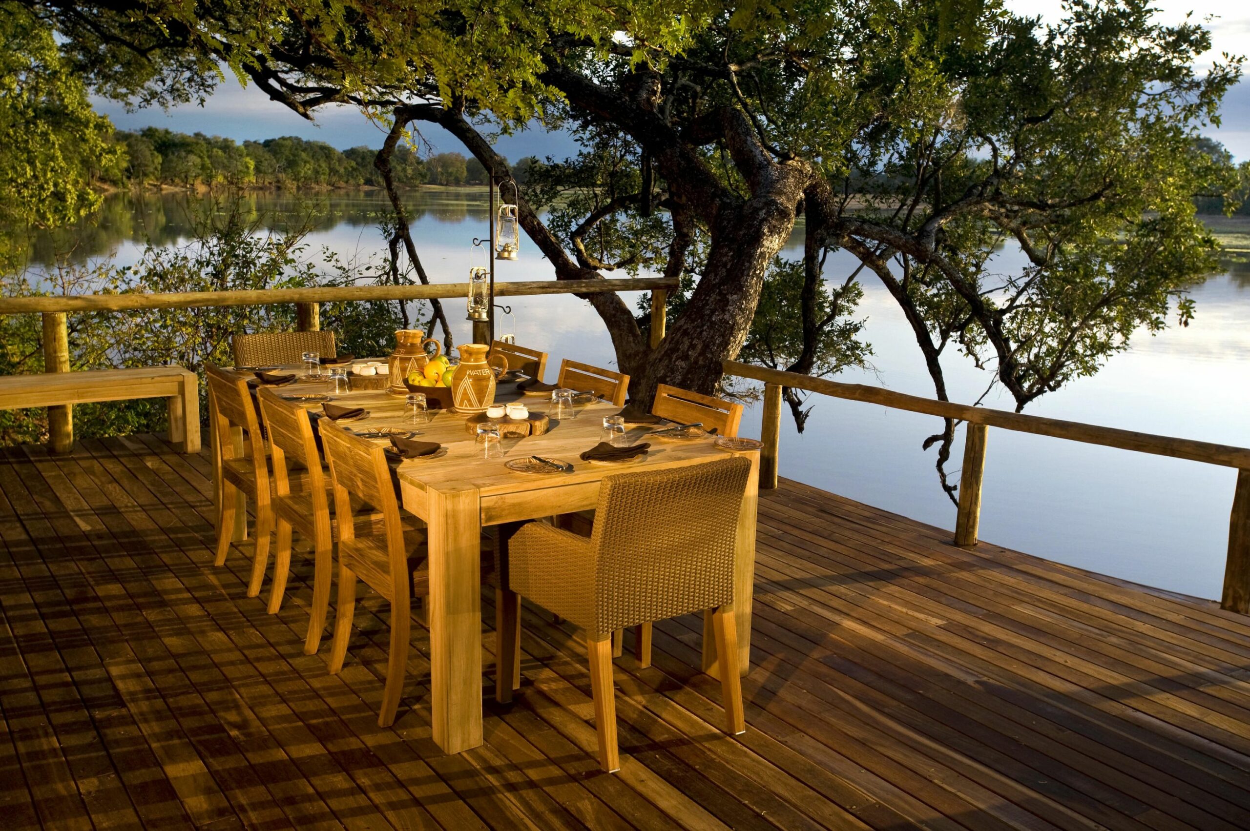 https://www.trackssafaris.co.uk/wp-content/uploads/2022/07/Chindeni-dining-deck-scaled.jpg