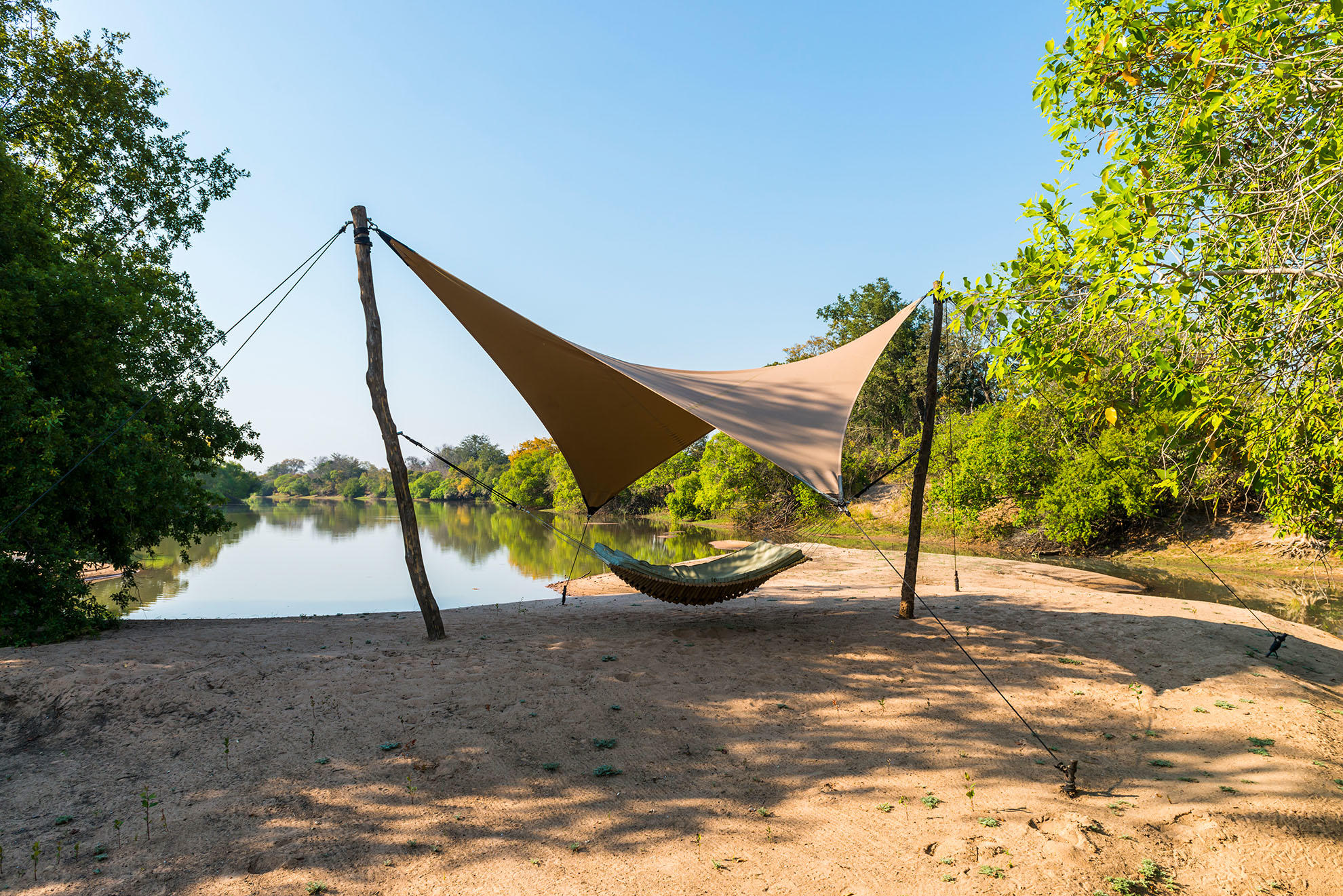 https://www.trackssafaris.co.uk/wp-content/uploads/2022/07/Hammock-on-the-beach-with-view-onto-the-lagoon-.jpg
