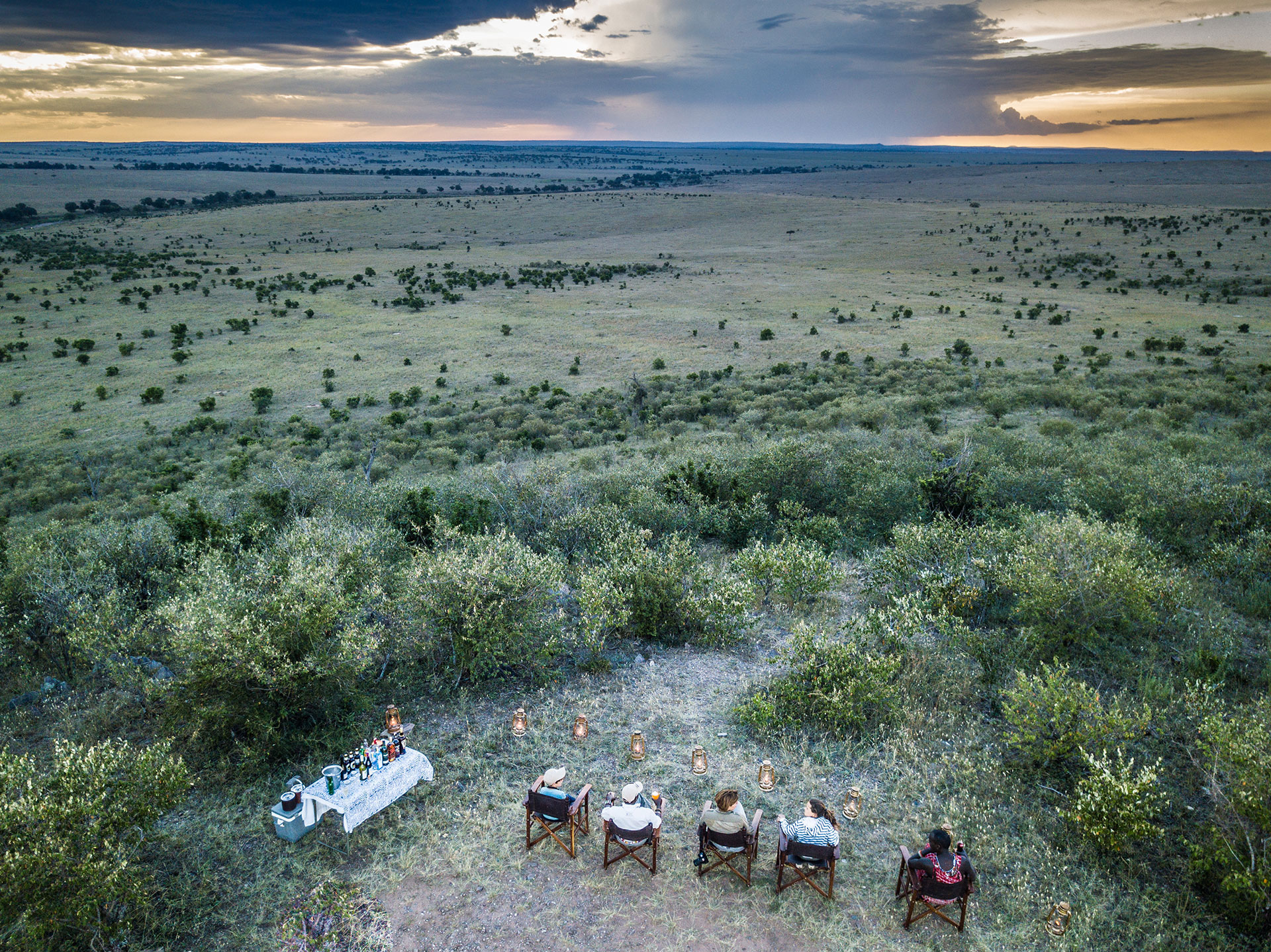 https://www.trackssafaris.co.uk/wp-content/uploads/2022/07/KENYA_The-Safari-Collection_Salas-Camp_17_-SALAS-CAMP-sundowners-in-the-Mara-copyright-scott-ramsay-copy.jpg
