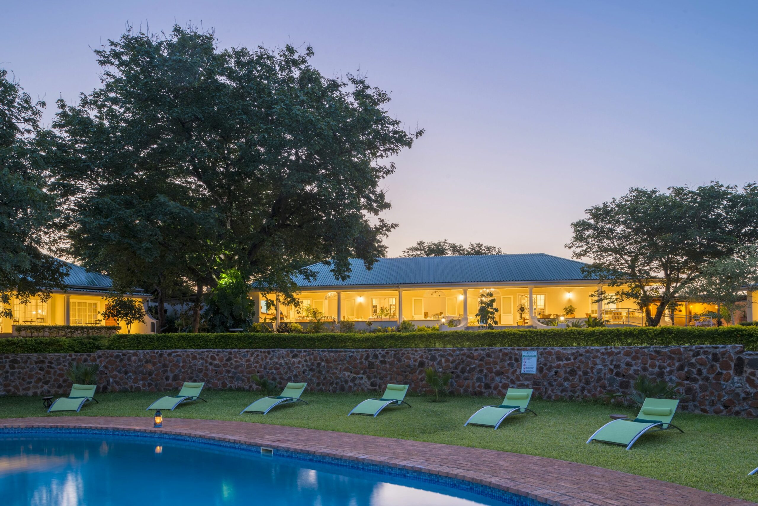 https://www.trackssafaris.co.uk/wp-content/uploads/2022/07/POOL-AND-LODGE-AT-NIGHT1-scaled.jpg