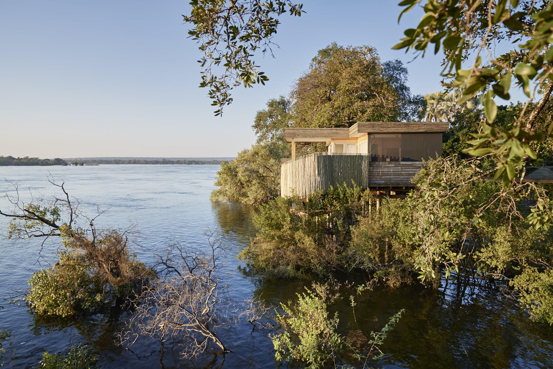 https://www.trackssafaris.co.uk/wp-content/uploads/2022/07/Victoria-Falls-River-Lodge-Island-Treehouse.jpg