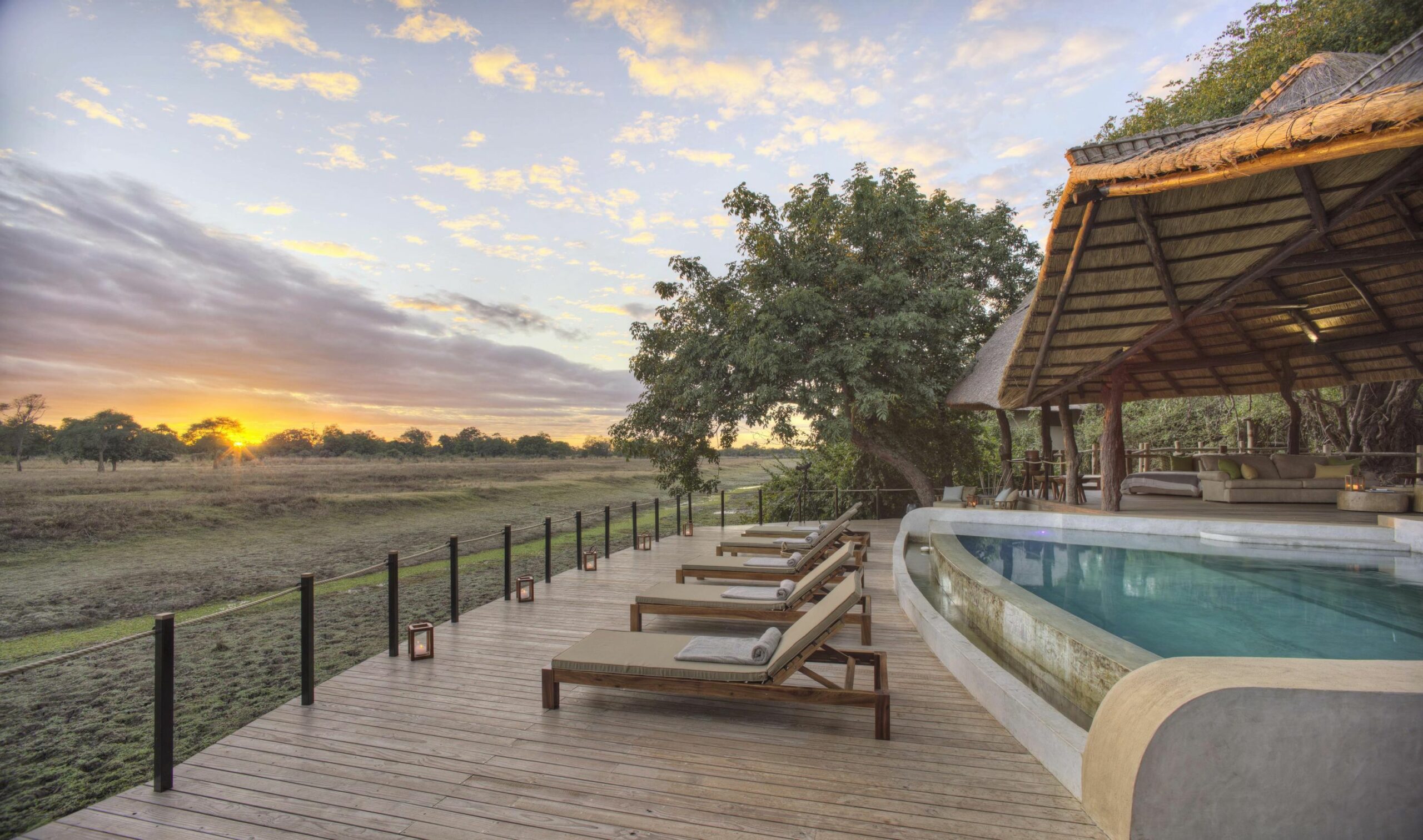 https://www.trackssafaris.co.uk/wp-content/uploads/2022/07/lounge-area-with-pool-scaled.jpg