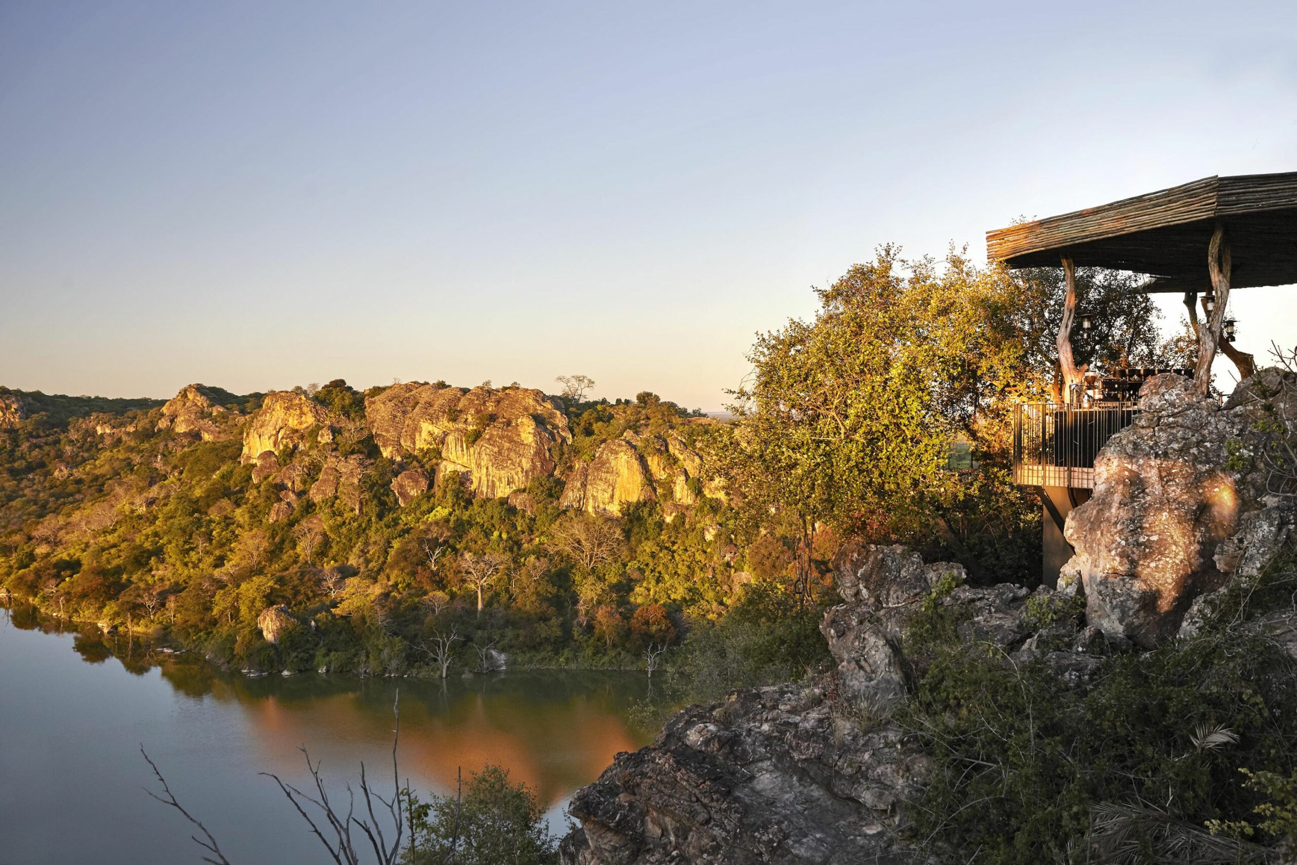 https://www.trackssafaris.co.uk/wp-content/uploads/2022/07/singita_pamushana_lodge_-_deck_overlooking_dam-scaled.jpg