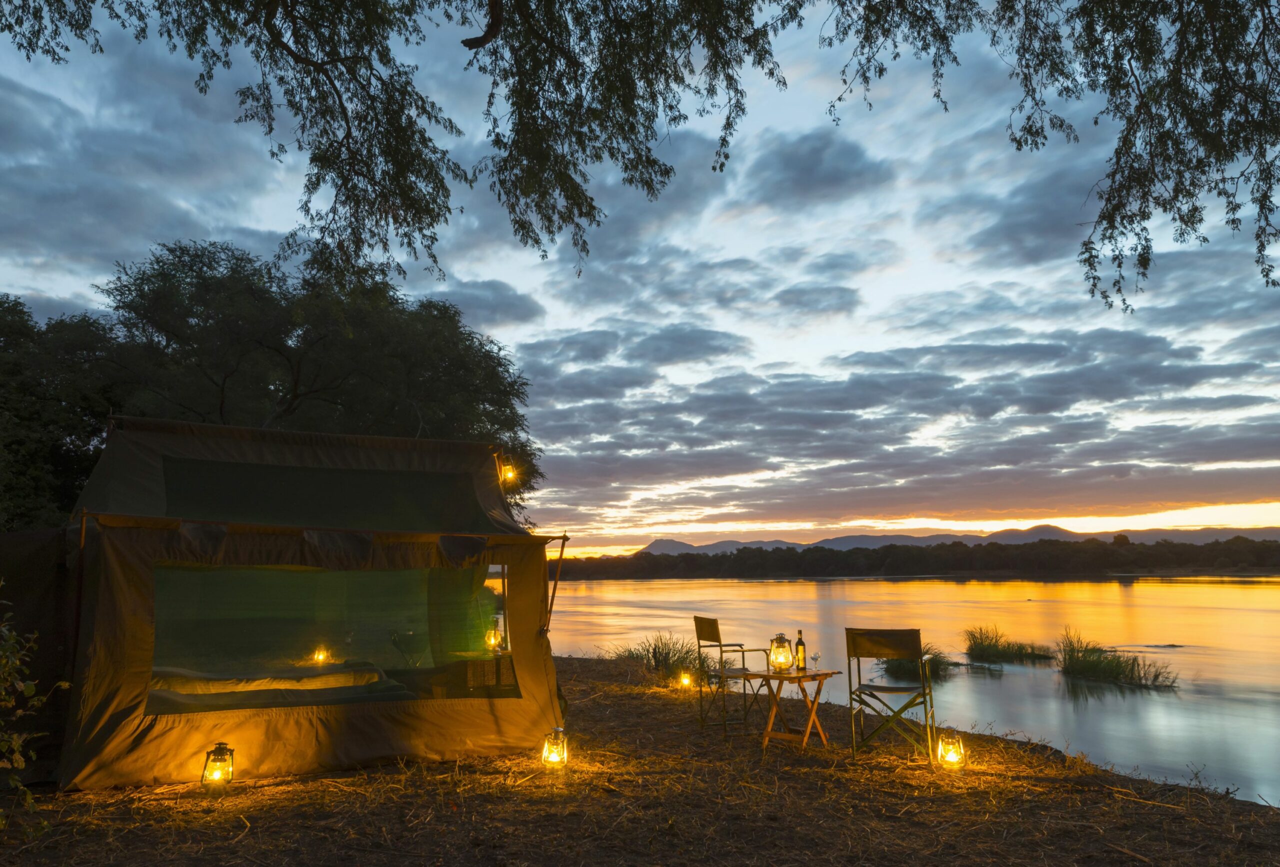 https://www.trackssafaris.co.uk/wp-content/uploads/2022/07/tent-at-dusk-scaled.jpg